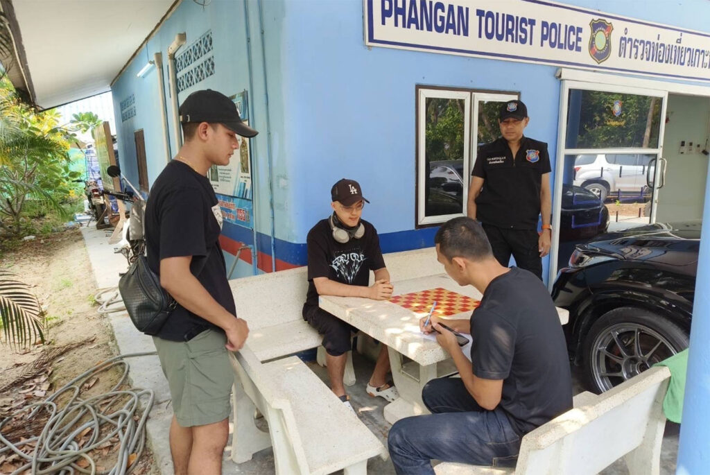 Danil Kulnevnich, 21, a Russian national, is questioned after his arrest for illegally running a motorcycle rental service on Koh Phangan in Surat Thani. Photo: @Bangkok Post Supapong Chaolan